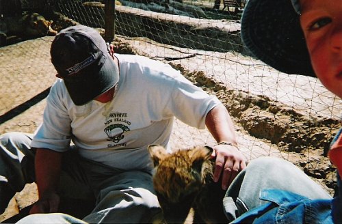 Tony stroking a hyena