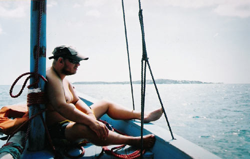 Tony sitting on a boat