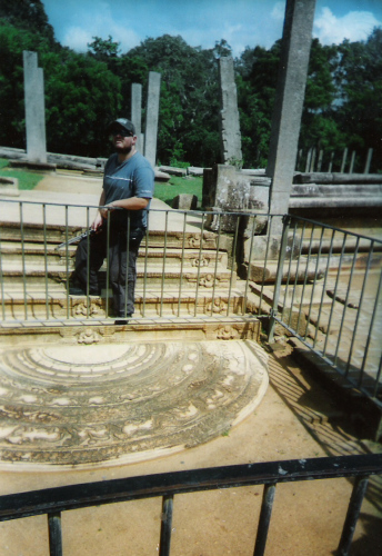 Tony beside a mosaic at Anuradhapura