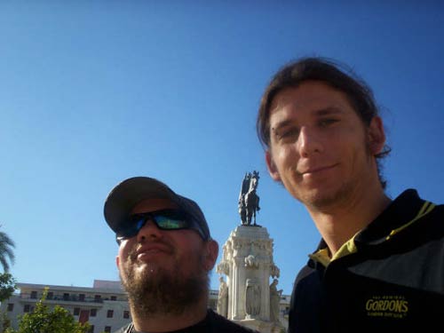 Tony and Will in front of a statue in Plaza Nueva