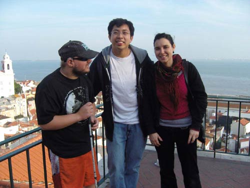 Tony with Leonard and Lurdes with a view of the city behind