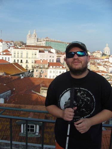 Tony with a view behind at a lookout in Alfama district