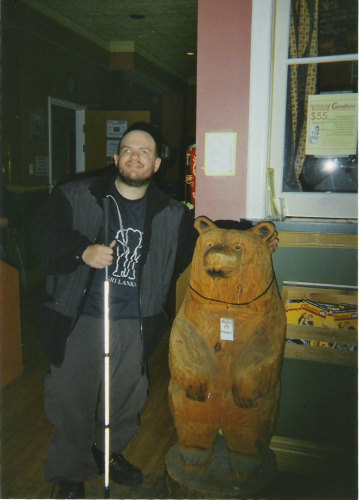 Tony with the bear at Canadiana Backpackers, Toronto