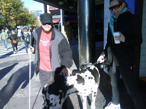 Tony with his hand on a Great Dane