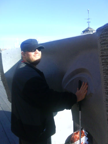 Tony touching sculpture