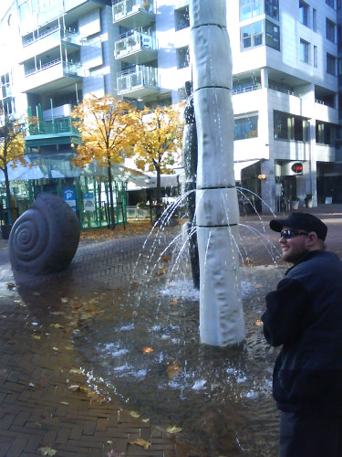 Tony beside a fountain in Oslo centre