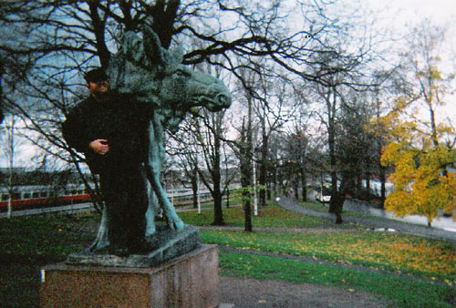 Tony standing in front of an elk statue