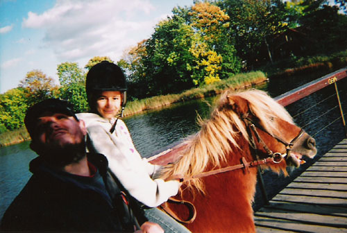 Girl on a horse and Tony. Christiania