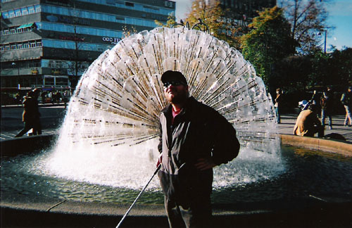Tony in front of a fountain